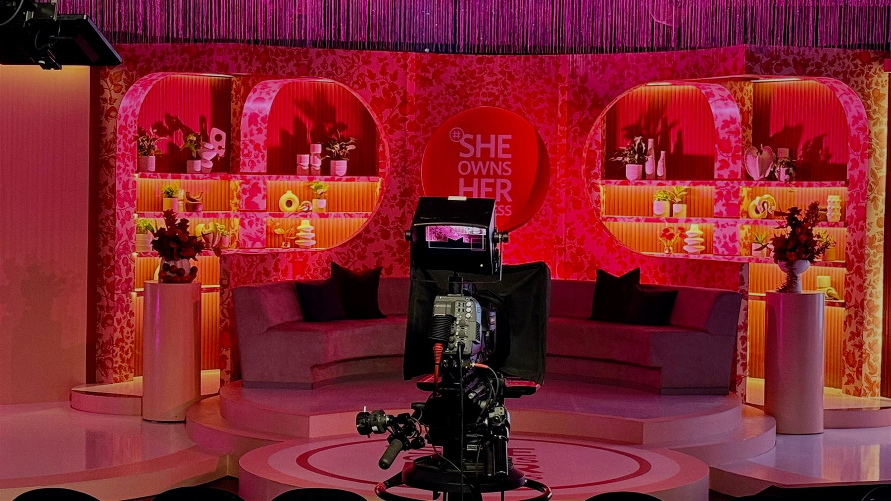 She Owns Her Success — lighting and set detail